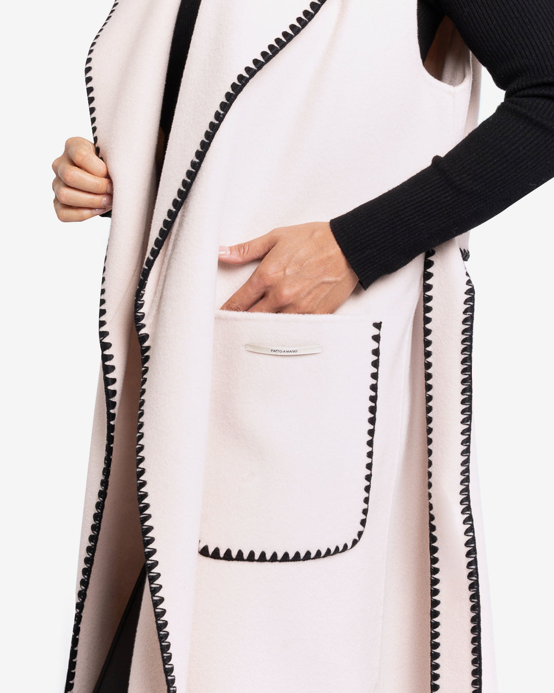 Sleeveless coat with black embroidered trim in champagne wool and cashmere